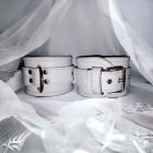 White leather wrist cuffs