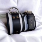 White and black leather wrist cuffs