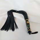Black leather BDSM flogger with Egyptian scarab motif
